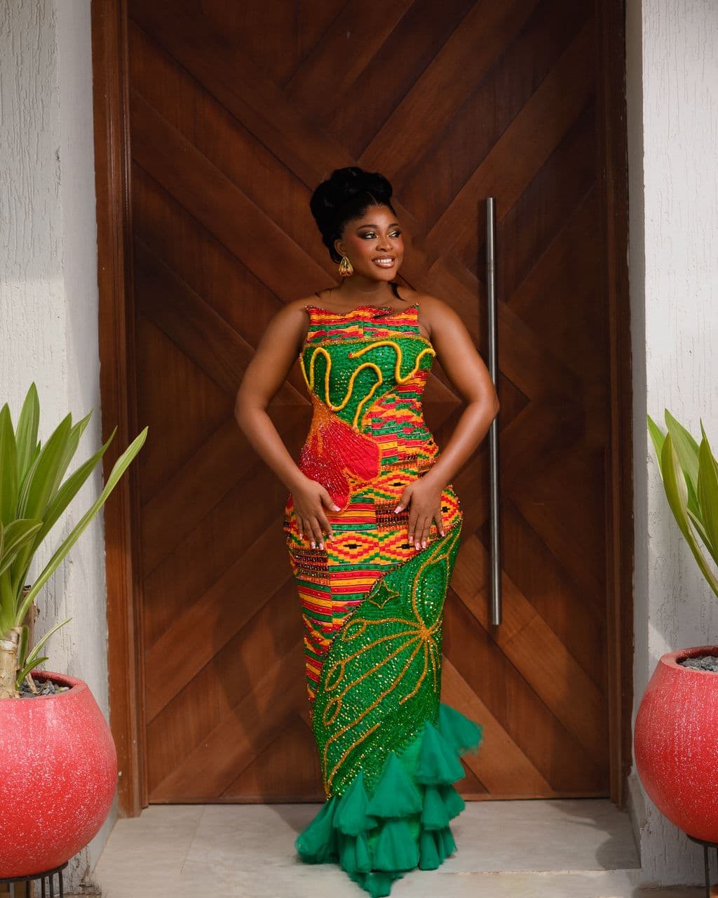 Red and gold Kente couture gown with beaded bodice